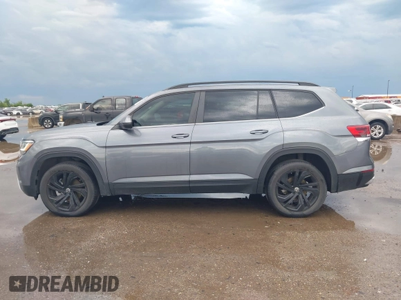 2022 Volkswagen Atlas SE z VIN 1V2JR2CA4NC529787, wystawiony jako IAAI lot #42051211 z przebiegiem 55 787 mil mil oraz . Historia ofert i sprzedaży dostępna na DreamBid. Obrazek 14.