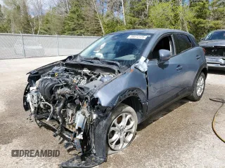 2021 Mazda CX-3 Touring z VIN JM1DKFC79M1504702, wystawiony jako Copart lot #56072725 z przebiegiem Nie podano mil oraz Szkoda całkowita • Salvage title. Historia ofert i sprzedaży dostępna na DreamBid. Obrazek 1.