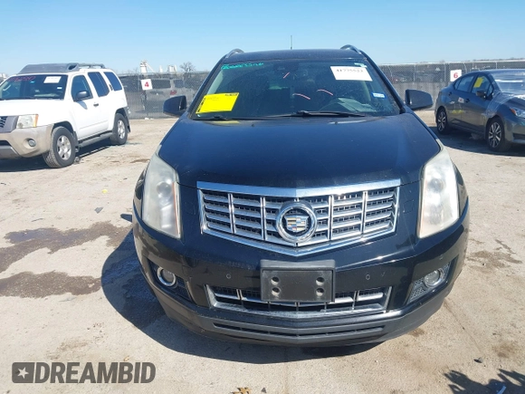 2014 Cadillac SRX Performance Collection z VIN 3GYFNCE35ES517868, wystawiony jako IAAI lot #41775522 z przebiegiem 166 960 mil mil oraz . Historia ofert i sprzedaży dostępna na DreamBid. Obrazek 12.