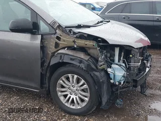 2014 Toyota Sienna XLE with VIN 5TDYK3DC0ES502482, listed as a IAAI auction lot 41910683 with 151,330 mi miles. Bid and sale history available at carsss.com. Image 6.