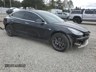 2019 Tesla Model 3 Mid Range z VIN 5YJ3E1EAXKF422500, wystawiony jako Copart lot #56065665 z przebiegiem 72 781 mil mil oraz Szkoda całkowita • Salvage title. Historia ofert i sprzedaży dostępna na DreamBid. Obrazek 4.