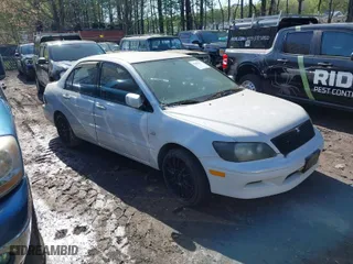 2003 Mitsubishi Lancer LS with VIN JA3AJ36E73U054672, listed as a IAAI auction lot 42002271 with 263,568 mi miles. Bid and sale history available at carsss.com. Image 1.