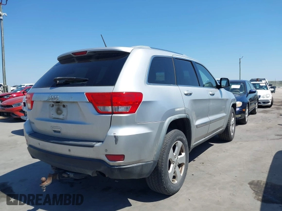 2012 Jeep Grand Cherokee Laredo with VIN 1C4RJEAG5CC112230, listed as a IAAI auction lot 41997483 with 302,923 mi miles. Bid and sale history available at carsss.com. Image 4.