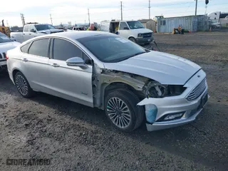 2017 Ford Fusion Energi SE with VIN 3FA6P0PU6HR276439, listed as a IAAI auction lot 41344083 with 134,391 mi miles. Bid and sale history available at carsss.com. Image 1.