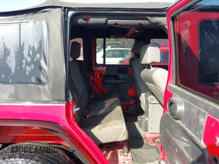 2007 Jeep Wrangler Unlimited X with VIN 1J4GB39197L150245, listed as a IAAI auction lot 41920390 with 239,532 mi miles and . Bid and sale history available at DreamBid. Image 8.