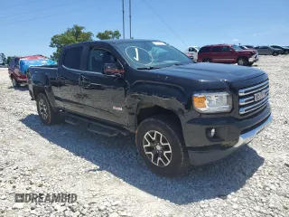 2015 GMC Canyon 4WD SLE with VIN 1GTG6BE32F1115990, listed as a Copart auction lot 71295314 with 118,913 mi miles and Salvage Title. Bid and sale history available at carsss.com. Image 7.