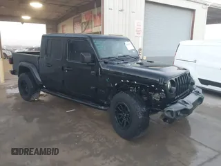 2022 Jeep Gladiator Willys with VIN 1C6HJTAG7NL132408, listed as a IAAI auction lot 41206764 with 57,185 mi miles and . Bid and sale history available at DreamBid. Image 1.