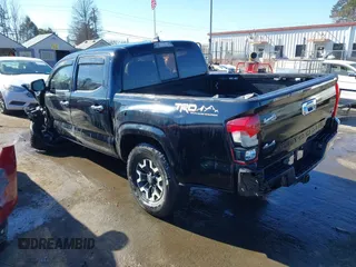 2018 Toyota Tacoma SR with VIN 5TFCZ5ANXJX124991, listed as a IAAI auction lot 41136867 with 57,980 mi miles and . Bid and sale history available at carsss.com. Image 3.