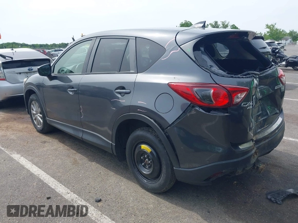 2016 Mazda CX-5 Touring z VIN JM3KE4CY4G0692655, wystawiony jako IAAI lot #42318657 z przebiegiem 212 826 mil mil oraz . Historia ofert i sprzedaży dostępna na DreamBid. Obrazek 3.