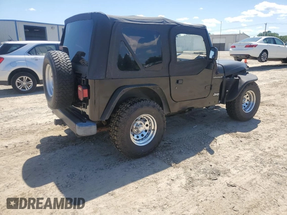 1999 Jeep Wrangler SE with VIN 1J4FY29P3XP408468, listed as a Copart auction lot 55537335 with Not provided miles and Salvage title. Bid and sale history available at DreamBid. Image 4.