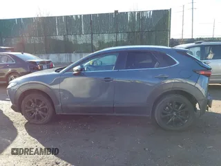 2023 Mazda CX-30 S Carbon Edition with VIN 3MVDMBCM3PM579345, listed as a IAAI auction lot 41689892 with 18,621 mi miles and . Bid and sale history available at DreamBid. Image 14.