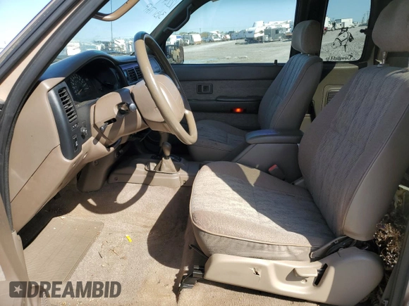 1999 Toyota Tacoma z VIN 4TAWN72N5XZ418522, wystawiony jako Copart lot #51940615 z przebiegiem 340 432 mil mil oraz Szkoda całkowita • Salvage title. Historia ofert i sprzedaży dostępna na DreamBid. Obrazek 7.