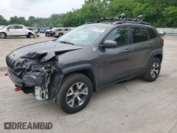 2014 Jeep Cherokee Trailhawk z VIN 1C4PJMBS9EW159721, wystawiony jako Copart lot #60719525 z przebiegiem 136 807 mil mil oraz Szkoda całkowita • Salvage title. Historia ofert i sprzedaży dostępna na DreamBid. Obrazek 1.