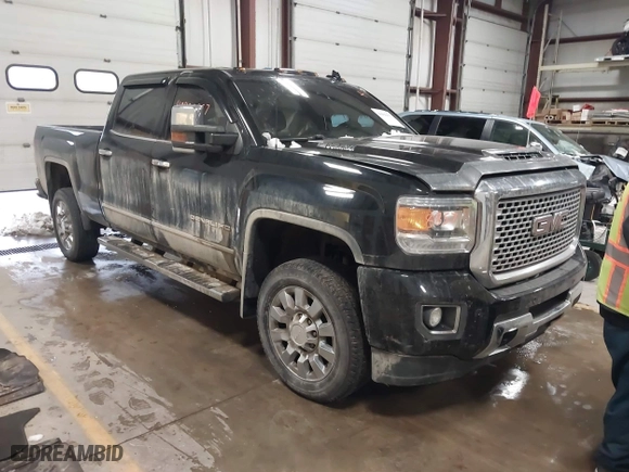 2017 GMC Sierra 2500HD Denali with VIN 1GT12UEY1HF212175, listed as a IAAI auction lot 40998857 with 80,297 mi miles. Bid and sale history available at carsss.com. Image 1.