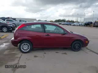 2007 Ford Focus S z VIN 1FAFP31N27W231884, wystawiony jako IAAI lot #41138534 z przebiegiem 84 506 mil mil oraz . Historia ofert i sprzedaży dostępna na DreamBid. Obrazek 14.