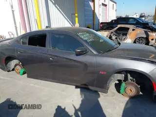 2019 Dodge Charger Scat Pack with VIN 2C3CDXGJ2KH564051, listed as a IAAI auction lot 41255283 with 64,687 mi miles and . Bid and sale history available at DreamBid. Image 13.