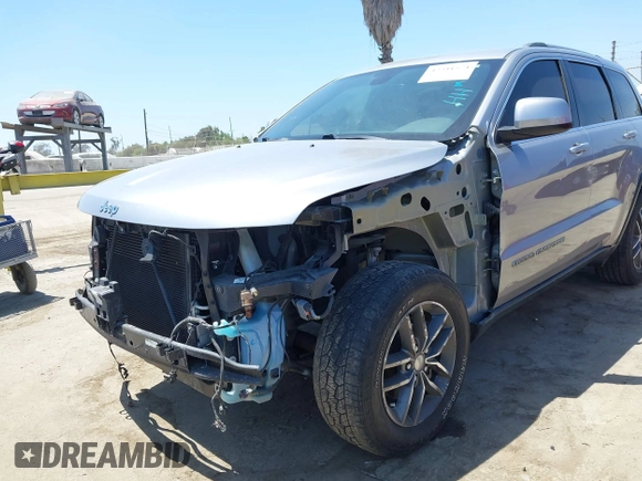2018 Jeep Grand Cherokee Laredo E with VIN 1C4RJEAG2JC429850, listed as a IAAI auction lot 42541574 with 72,009 mi miles and . Bid and sale history available at DreamBid. Image 6.