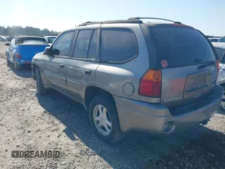 2005 GMC Envoy SLT with VIN 1GKDS13SX52175970, listed as a IAAI auction lot 42047871 with 205,432 mi miles. Bid and sale history available at carsss.com. Image 3.