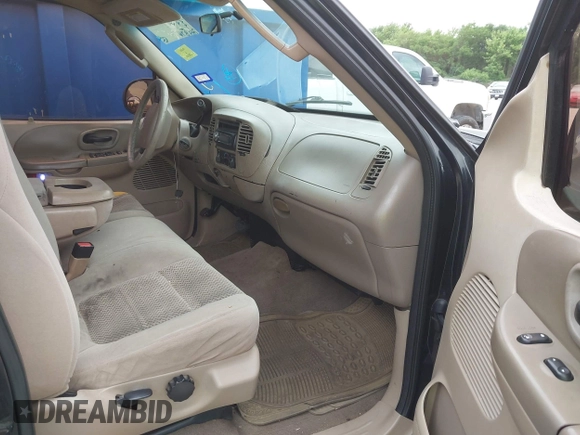 2002 Ford F-150 XLT with VIN 1FTRW07692KE26387, listed as a IAAI auction lot 42079023 with 218,876 mi miles. Bid and sale history available at carsss.com. Image 5.