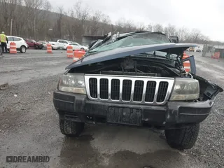 2002 Jeep Grand Cherokee Laredo with VIN 1J4GW48S82C321712, listed as a IAAI auction lot 41855809 with 1 mi miles. Bid and sale history available at carsss.com. Image 12.