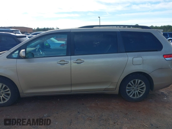 2011 Toyota Sienna XLE AAS with VIN 5TDYK3DCXBS117023, listed as a IAAI auction lot 41581785 with 216,341 mi miles. Bid and sale history available at carsss.com. Image 14.