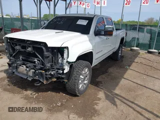 2016 GMC Sierra 2500HD Denali with VIN 1GT12UE86GF267431, listed as a IAAI auction lot 42091770 with 128,525 mi miles and . Bid and sale history available at DreamBid. Image 2.