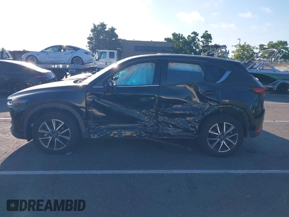 2018 Mazda CX-5 Grand Touring with VIN JM3KFBDM1J0345014, listed as a IAAI auction lot 42703926 with 151,453 mi miles and . Bid and sale history available at DreamBid. Image 14.