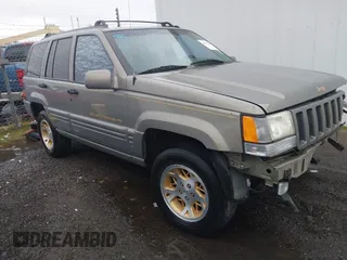 1998 Jeep Grand Cherokee Limited with VIN 1J4GZ78YXWC236969, listed as a IAAI auction lot 41095686 with 182,001 mi miles. Bid and sale history available at carsss.com. Image 1.