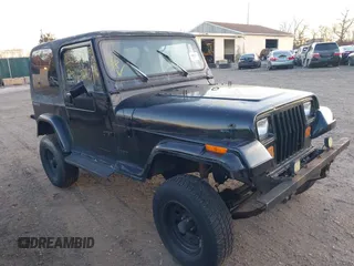 1990 Jeep Wrangler with VIN 2J4FY29T2LJ543655, listed as a IAAI auction lot 41766772 with 999,999 mi miles. Bid and sale history available at carsss.com. Image 1.