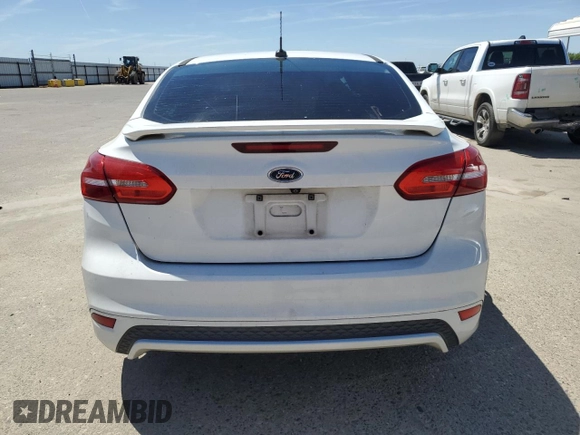 2016 Ford Focus SE with VIN 1FADP3F22GL329241, listed as a Copart auction lot 58095135 with 105,079 mi miles and Salvage title. Bid and sale history available at DreamBid. Image 6.