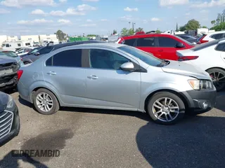 2012 Chevrolet Sonic LT with VIN 1G1JC5SH9C4136290, listed as a IAAI auction lot 42034254 with 273,427 mi miles and . Bid and sale history available at DreamBid. Image 13.
