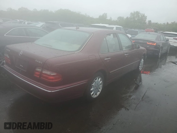 2002 Mercedes-Benz E 320 with VIN WDBJF82J22X070566, listed as a Copart auction lot 55964535 with 238,240 mi miles and Salvage Title. Bid and sale history available at DreamBid. Image 3.
