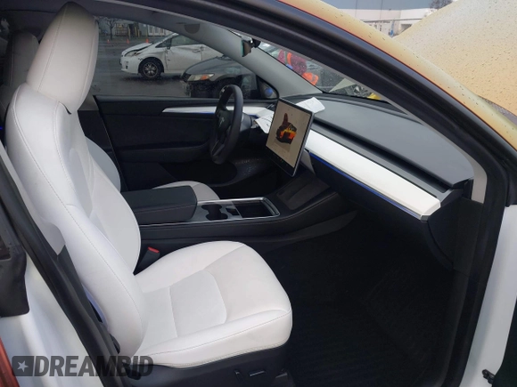 2023 Tesla Model Y Performance with VIN 7SAYGDEF4PF738885, listed as a IAAI auction lot 41798997 with 59,270 mi miles and . Bid and sale history available at DreamBid. Image 5.