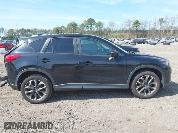 2016 Mazda CX-5 Grand Touring with VIN JM3KE4DY8G0639570, listed as a IAAI auction lot 42098512 with 126,541 mi miles and . Bid and sale history available at carsss.com. Image 13.