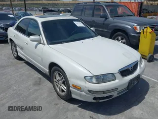 1999 Mazda Millenia z VIN JM1TA221XX1501221, wystawiony jako IAAI lot #42237562 z przebiegiem 158 048 mil mil oraz . Historia ofert i sprzedaży dostępna na DreamBid. Obrazek 1.