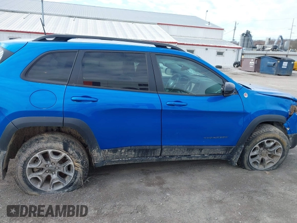 2022 Jeep Cherokee Trailhawk z VIN 1C4PJMBX1ND539319, wystawiony jako IAAI lot #41811178 z przebiegiem 49 922 mil mil oraz . Historia ofert i sprzedaży dostępna na DreamBid. Obrazek 14.
