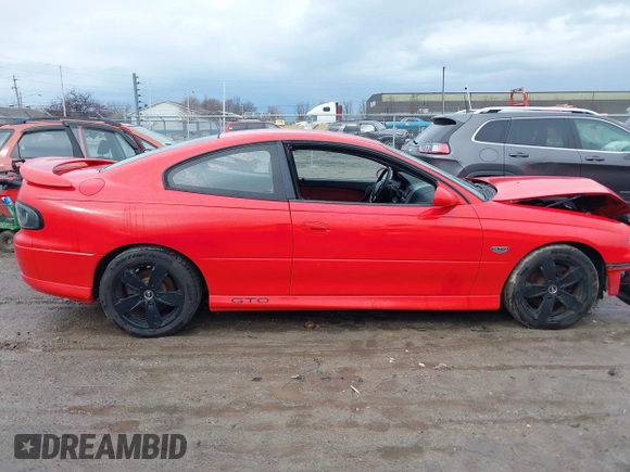 2004 Pontiac GTO z VIN 6G2VX12G34L221749, wystawiony jako IAAI lot #41679612 z przebiegiem Nie podano mil oraz . Historia ofert i sprzedaży dostępna na DreamBid. Obrazek 12.