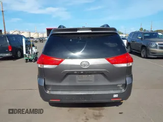 2014 Toyota Sienna XLE with VIN 5TDYK3DC2ES438980, listed as a IAAI auction lot 42067750 with 143,728 mi miles and . Bid and sale history available at DreamBid. Image 16.
