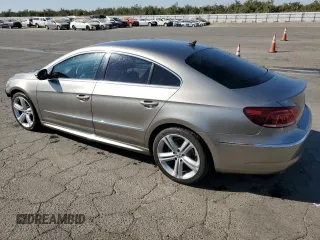 2013 Volkswagen CC R-Line with VIN WVWBP7AN2DE556410, listed as a Copart auction lot 77360244 with 114,891 mi miles and Salvage Title. Bid and sale history available at DreamBid. Image 2.