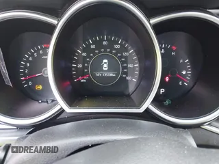 2014 Kia Optima LX z VIN 5XXGM4A72EG337457, wystawiony jako IAAI lot #42486150 z przebiegiem 135 338 mil mil oraz . Historia ofert i sprzedaży dostępna na DreamBid. Obrazek 7.