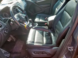 2014 Volkswagen Tiguan SEL z VIN WVGAV3AX6EW030705, wystawiony jako Copart lot #52156805 z przebiegiem 142 377 mil mil oraz Szkoda całkowita • Salvage title. Historia ofert i sprzedaży dostępna na DreamBid. Obrazek 7.