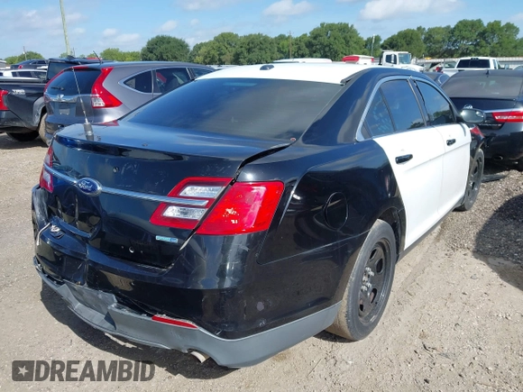 2014 Ford Police Interceptor with VIN 1FAHP2MK8EG185666, listed as a IAAI auction lot 42608018 with 141,523 mi miles and . Bid and sale history available at DreamBid. Image 4.