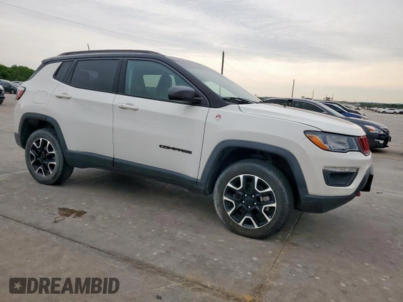 2020 Jeep Compass Trailhawk with VIN 3C4NJDDB3LT189398, listed as a Copart auction lot 59376995 with 75,674 mi miles and Salvage title. Bid and sale history available at DreamBid. Image 4.