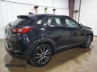 2018 Mazda CX-3 Touring z VIN JM1DKFC75J0301307, wystawiony jako Copart lot #56302175 z przebiegiem 107 676 mil mil oraz Szkoda całkowita • Salvage title. Historia ofert i sprzedaży dostępna na DreamBid. Obrazek 3.