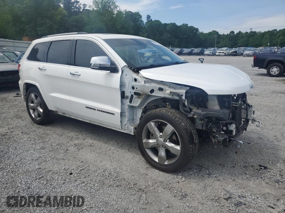 2017 Jeep Grand Cherokee Overland with VIN 1C4RJFCT7HC734125, listed as a Copart auction lot 54333215 with 101,229 mi miles and Salvage title. Bid and sale history available at DreamBid. Image 4.