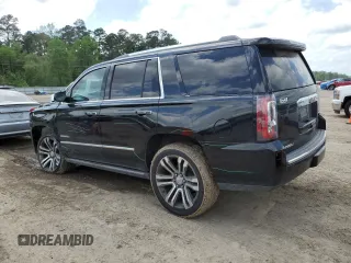 2019 GMC Yukon Denali with VIN 1GKS1CKJ0KR259491, listed as a Copart auction lot 51071335 with 105,294 mi miles and Salvage Title. Bid and sale history available at carsss.com. Image 2.