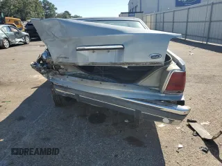 1989 Ford Crown Victoria z VIN 2FABP74F2KX141884, wystawiony jako Copart lot #74934494 z przebiegiem 84 761 mil mil oraz Szkoda całkowita • Salvage title. Historia ofert i sprzedaży dostępna na DreamBid. Obrazek 6.
