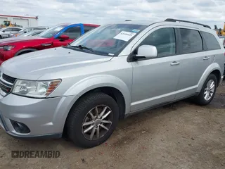 2013 Dodge Journey SXT with VIN 3C4PDDBG4DT571469, listed as a IAAI auction lot 42104433 with 166,068 mi miles and . Bid and sale history available at DreamBid. Image 2.