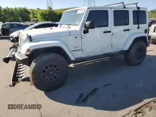 2014 Jeep Wrangler Unlimited Sahara with VIN 1C4BJWEG9EL198016, listed as a Copart auction lot 60926645 with 106,821 mi miles and Salvage title. Bid and sale history available at DreamBid. Image 1.