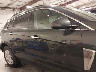 2014 Cadillac SRX with VIN 3GYFNAE34ES665630, listed as a IAAI auction lot 41315281 with 99,009 mi miles and . Bid and sale history available at DreamBid. Image 13.